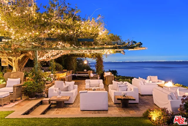 a view of a park with iron fence