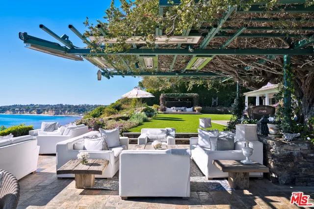 a view of a house with a garden and yard