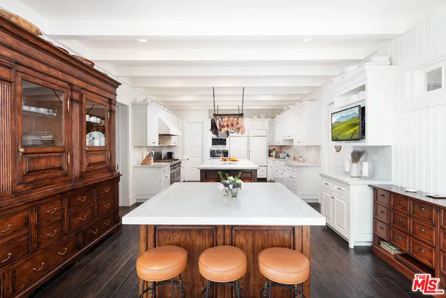 a bedroom with furniture and a fireplace