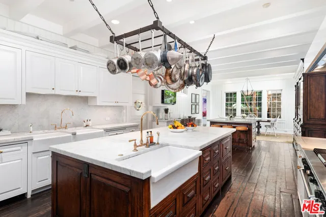 a living room with furniture and floor to ceiling windows