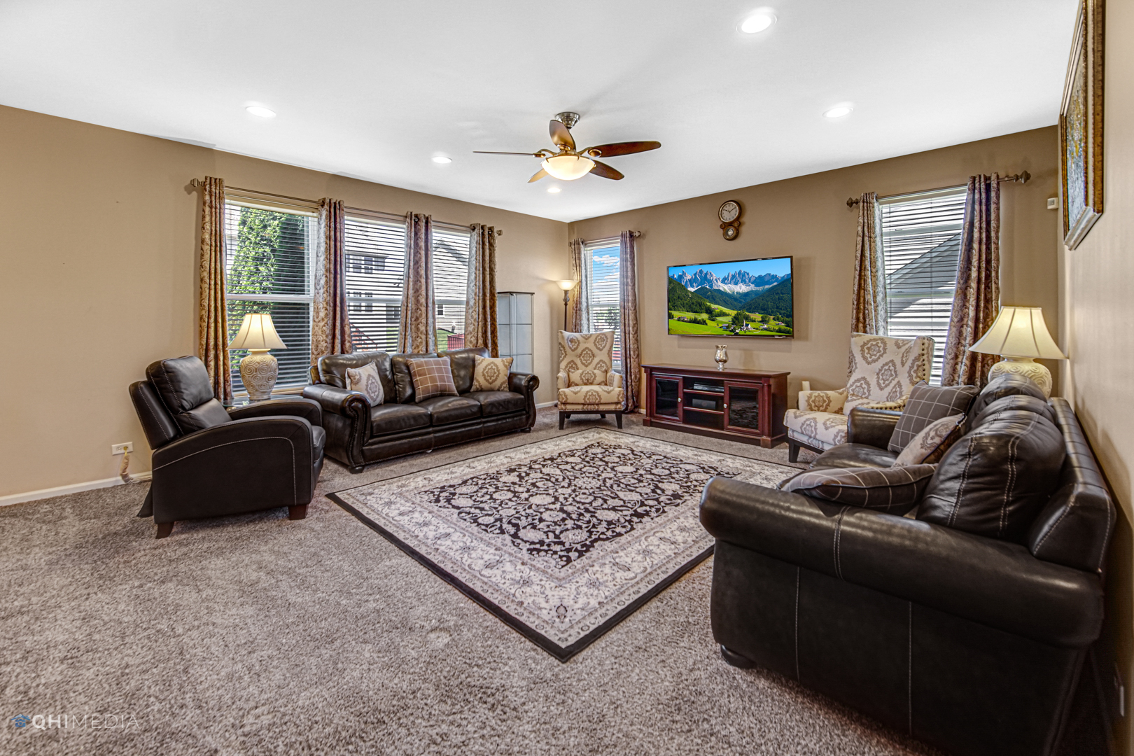 318 Monument Road Elgin, IL 60124 - Photo 14 of 31 a living room with furniture and a flat screen tv