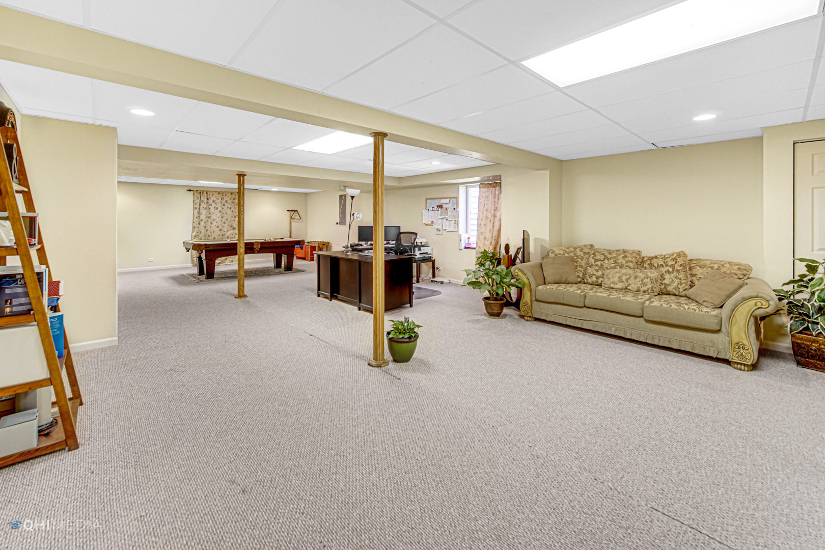 318 Monument Road Elgin, IL 60124 - Photo 23 of 31 a living room with furniture and white walls