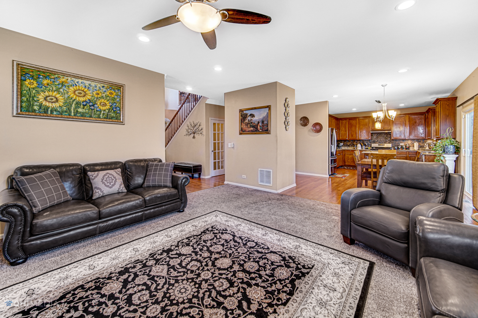 318 Monument Road Elgin, IL 60124 - Photo 8 of 31 a living room with furniture and a rug