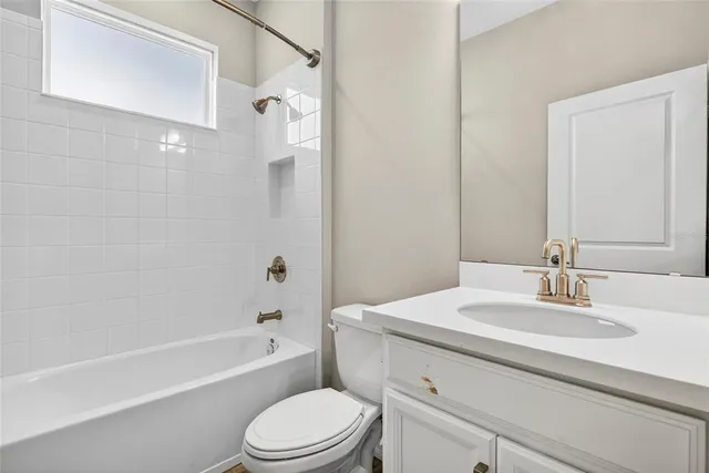 a bathroom with a sink a toilet and a bathtub