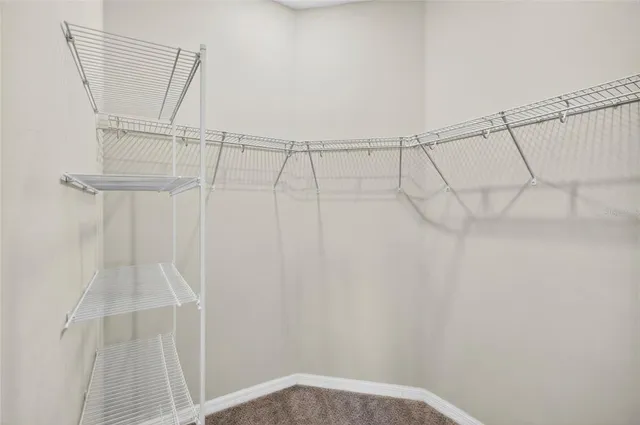 a view of a room with racks on the wall