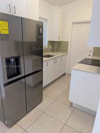 a kitchen with a stove and a microwave