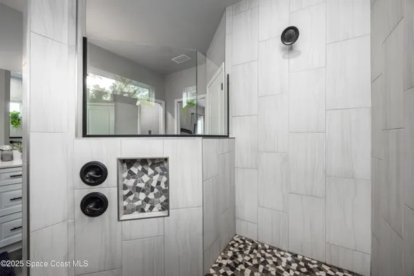 a view of a big yard with sitting area