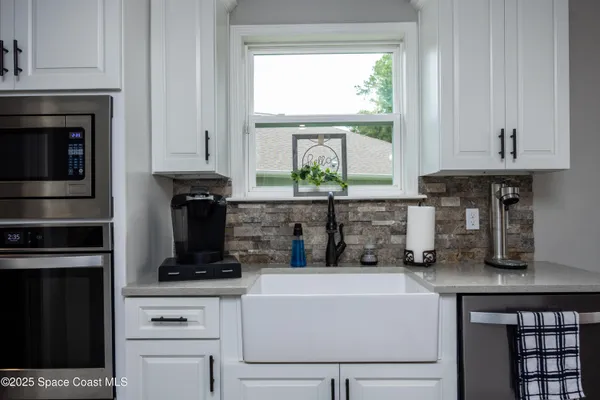 a bathroom with a mirror and shower