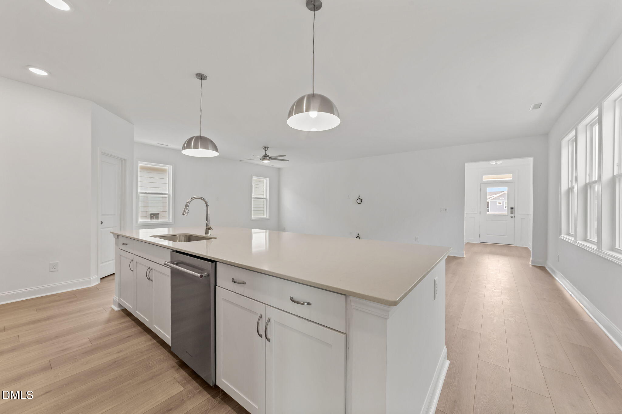 77 Watauga Way Clayton, NC 27520 - Photo 6 of 10 a kitchen with stainless steel appliances granite countertop a sink a stove and a wooden floor
