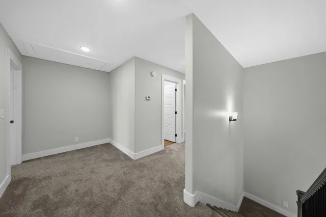 a view of hallway with a sink