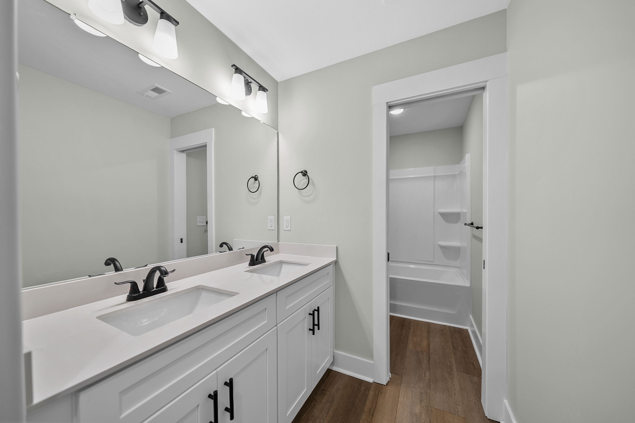 2509 Ashland City Road Clarksville, TN 37043 - Photo 25 of 32 a bathroom with a sink a mirror and a shower
