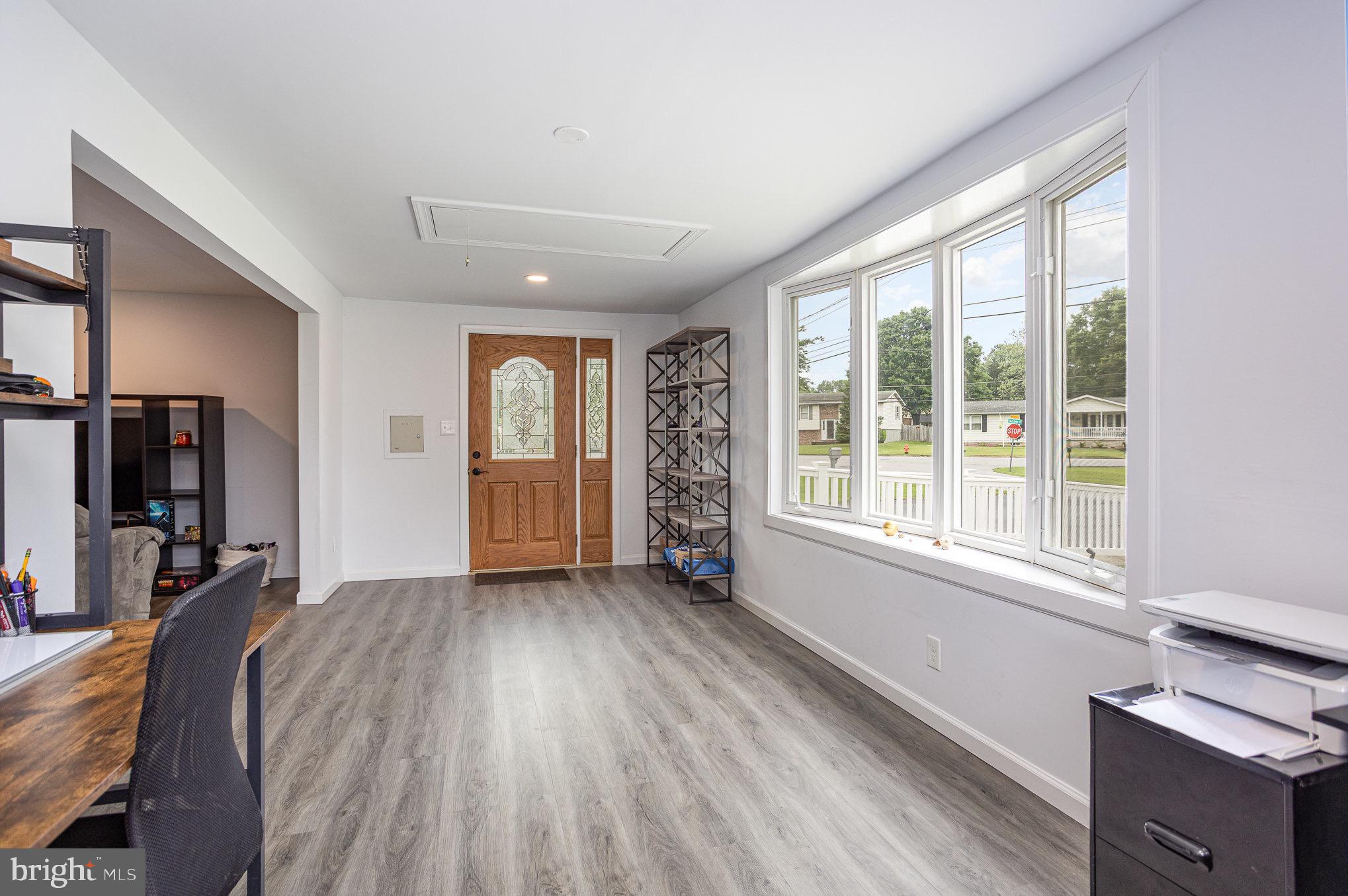 7307 Tred Avon Road Middle River, MD 21220 - Photo 3 of 39 a view of livingroom with furniture wooden floor and window