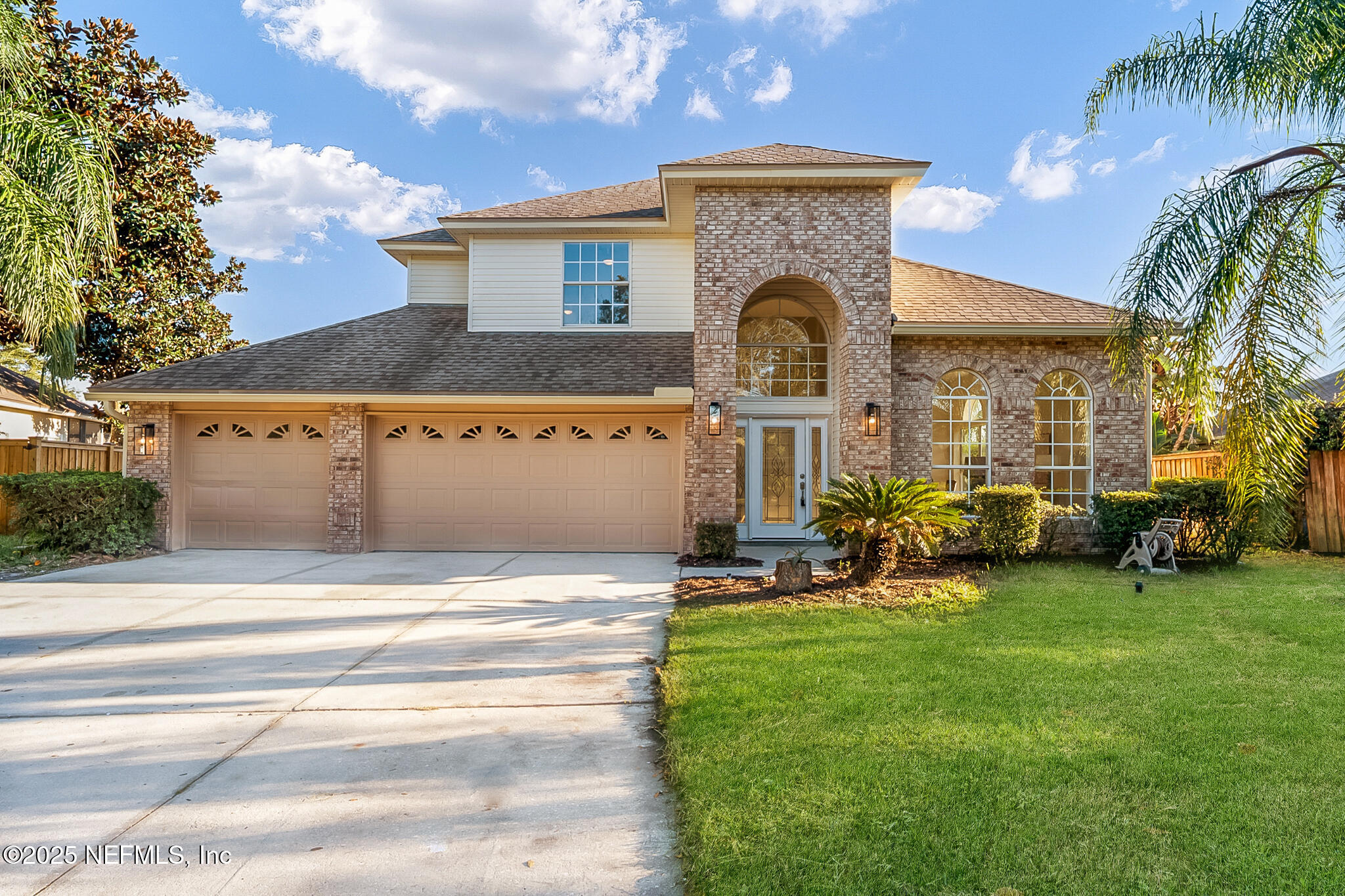 a front view of a house with patio yard and outdoor seating