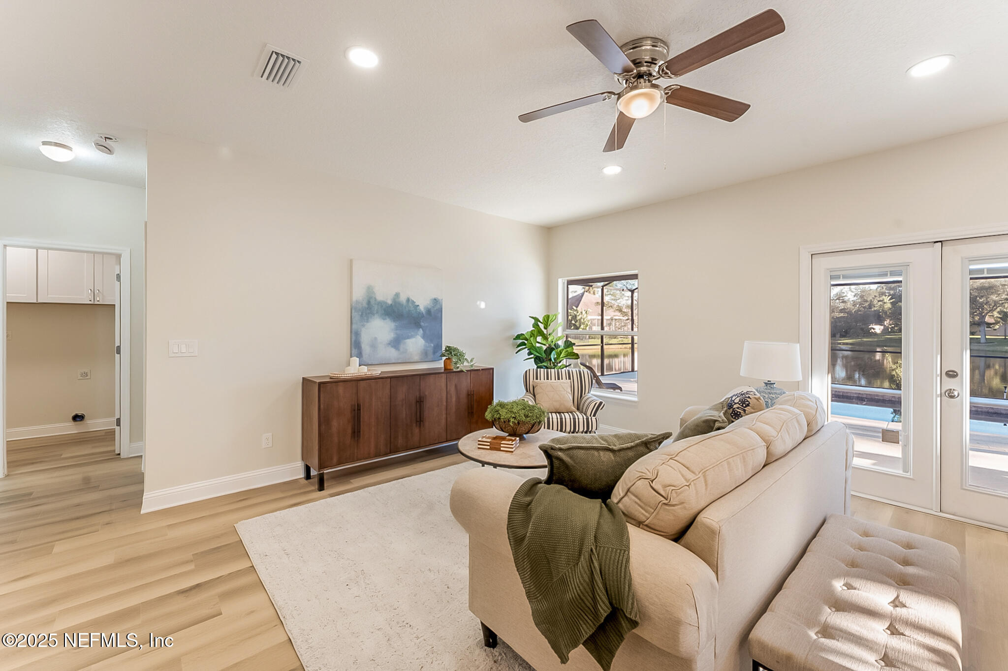 13962 Ibis Point Boulevard Jacksonville, FL 32224 - Photo 14 of 63 a living room with furniture and a wooden floor