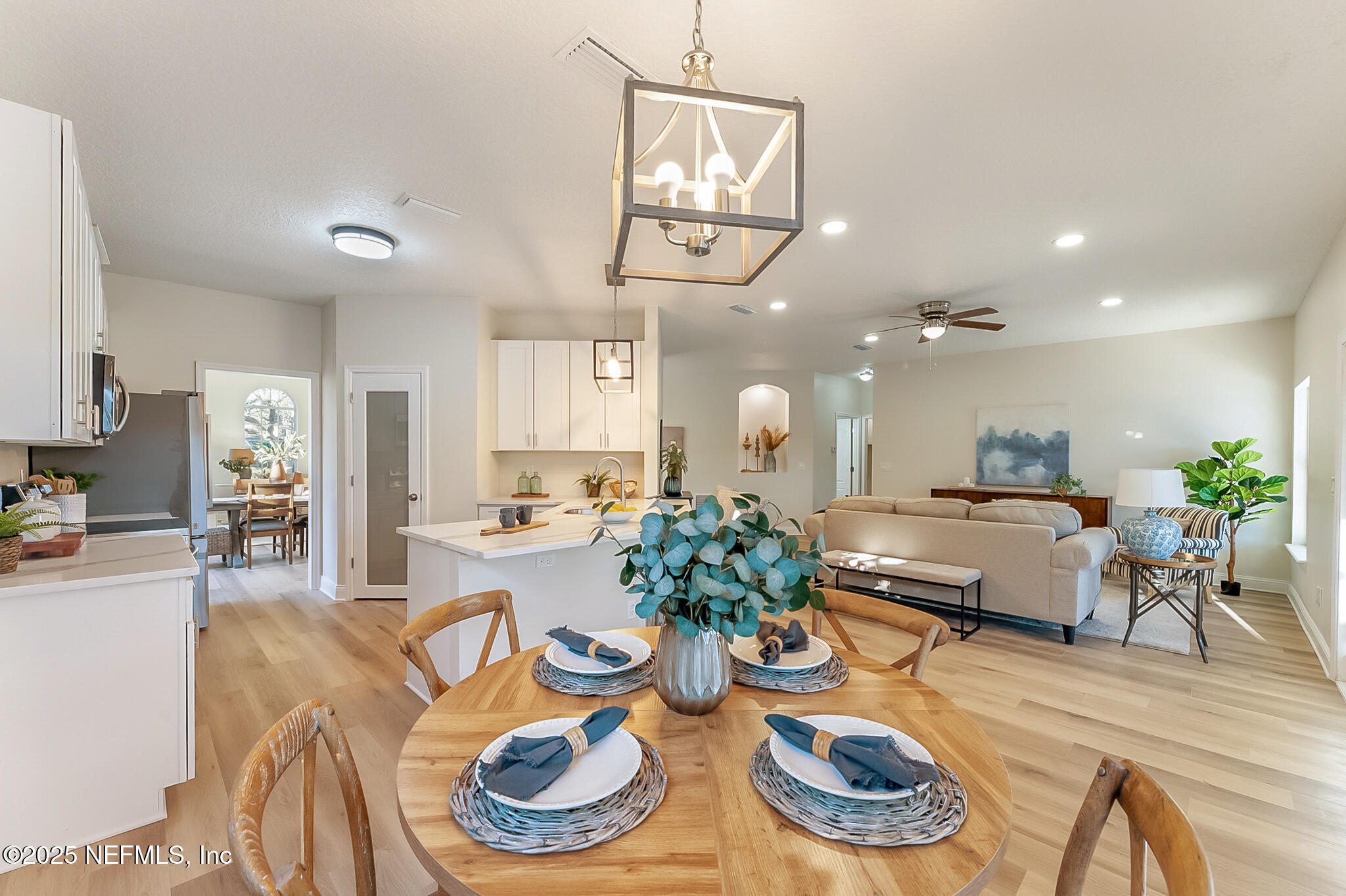 13962 Ibis Point Boulevard Jacksonville, FL 32224 - Photo 19 of 63 a living room with dining room and wooden floor