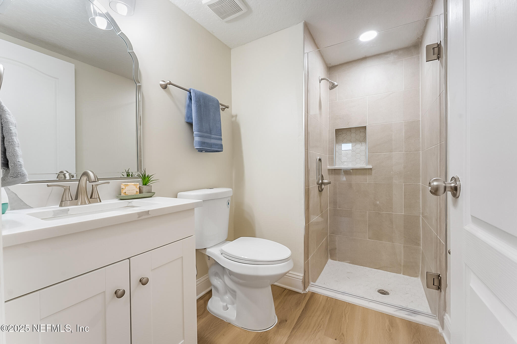 13962 Ibis Point Boulevard Jacksonville, FL 32224 - Photo 24 of 63 a bathroom with a sink a toilet and shower