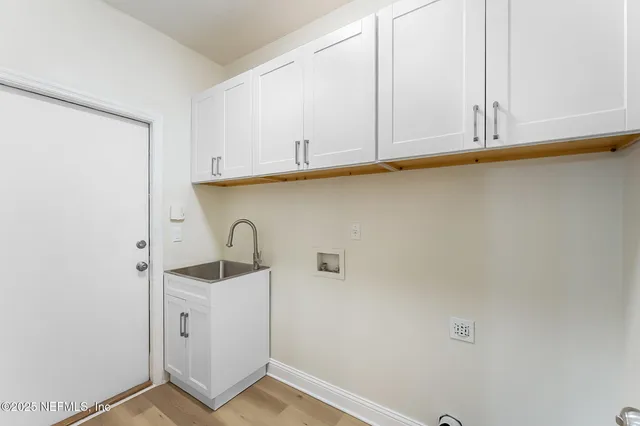 a bathroom with a tub shower and mirror