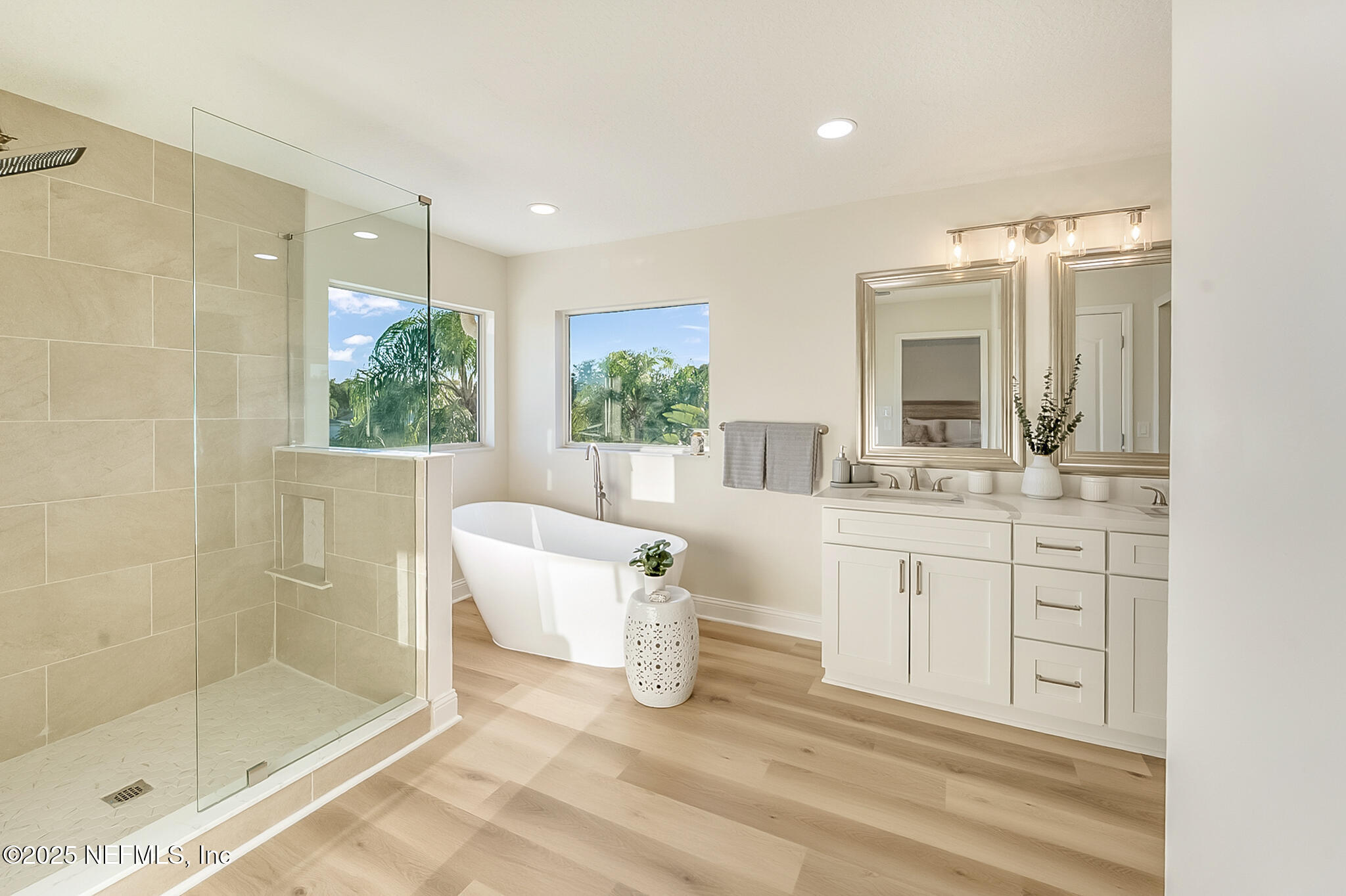 13962 Ibis Point Boulevard Jacksonville, FL 32224 - Photo 3 of 63 a spacious bathroom with a shower sink and mirror