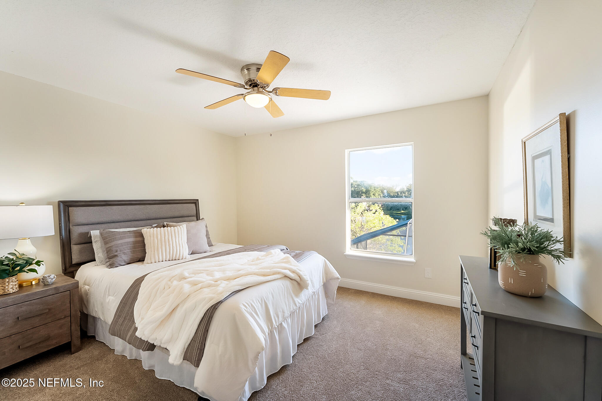 13962 Ibis Point Boulevard Jacksonville, FL 32224 - Photo 35 of 63 a bedroom with a bed and a window