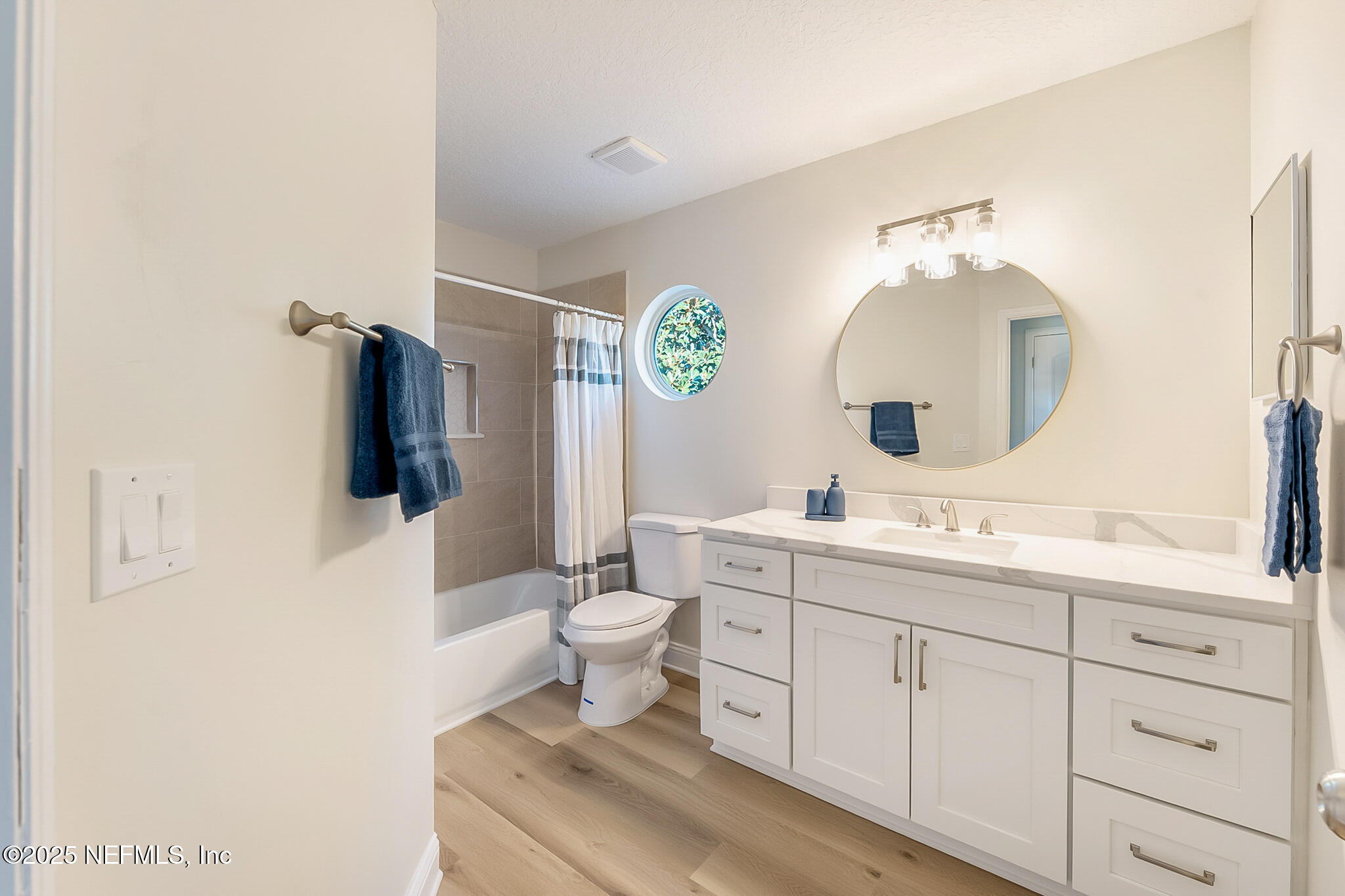 13962 Ibis Point Boulevard Jacksonville, FL 32224 - Photo 37 of 63 a bathroom with a toilet a sink a mirror and vanity