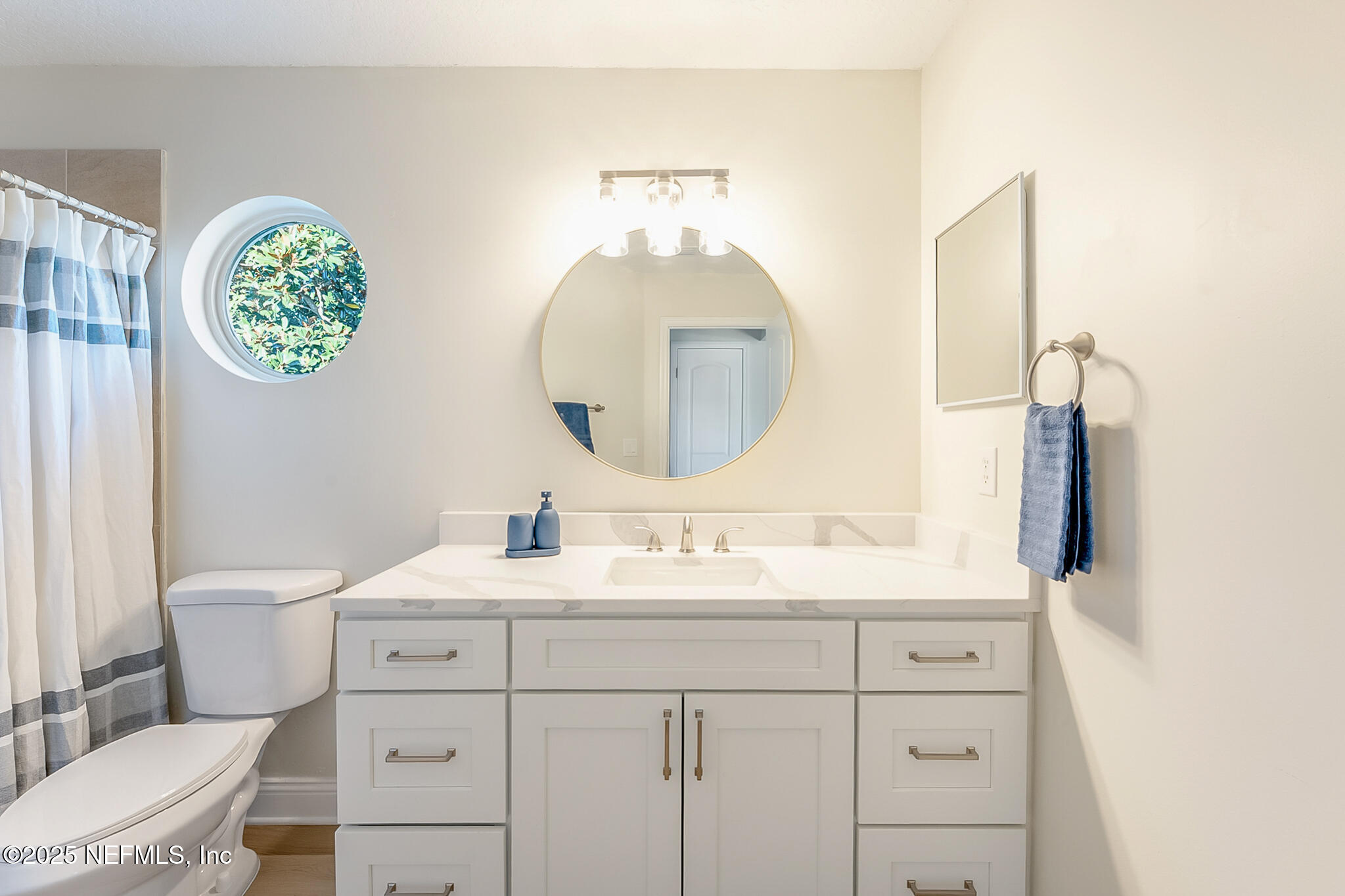 13962 Ibis Point Boulevard Jacksonville, FL 32224 - Photo 38 of 63 a bathroom with a toilet sink and mirror
