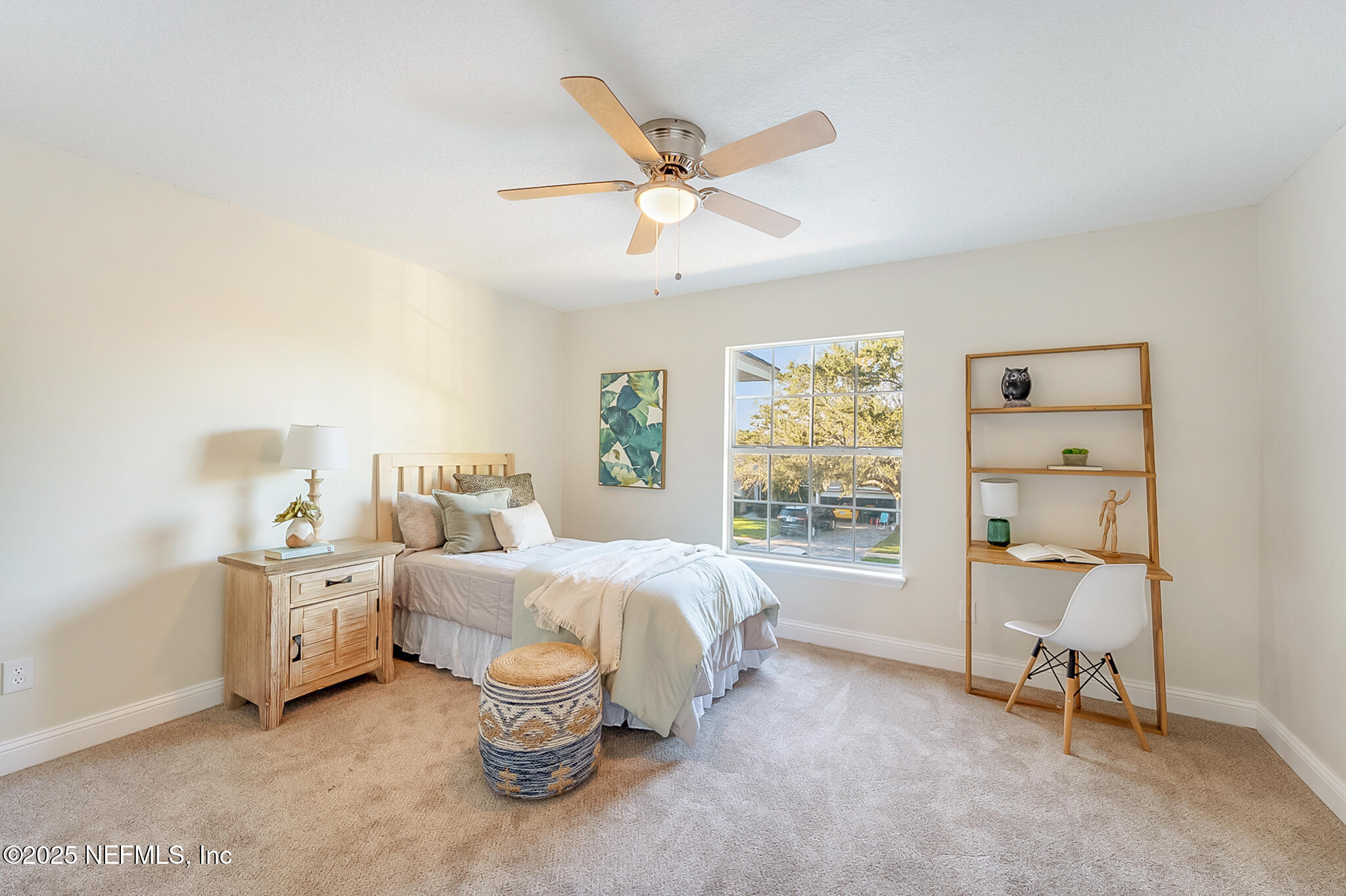 13962 Ibis Point Boulevard Jacksonville, FL 32224 - Photo 39 of 63 a bedroom with a bed and a window