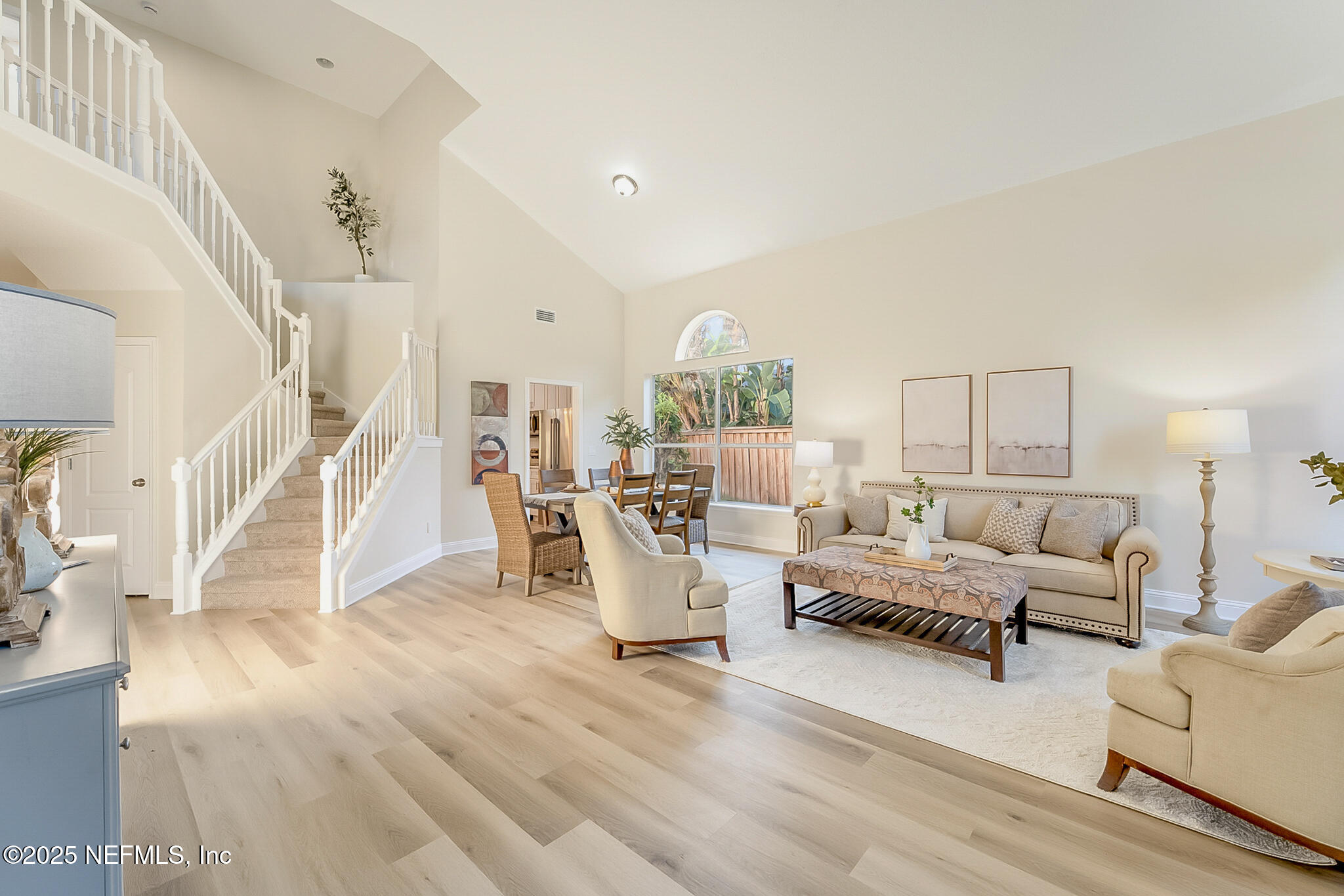 13962 Ibis Point Boulevard Jacksonville, FL 32224 - Photo 42 of 63 a living room with furniture and a wooden floor
