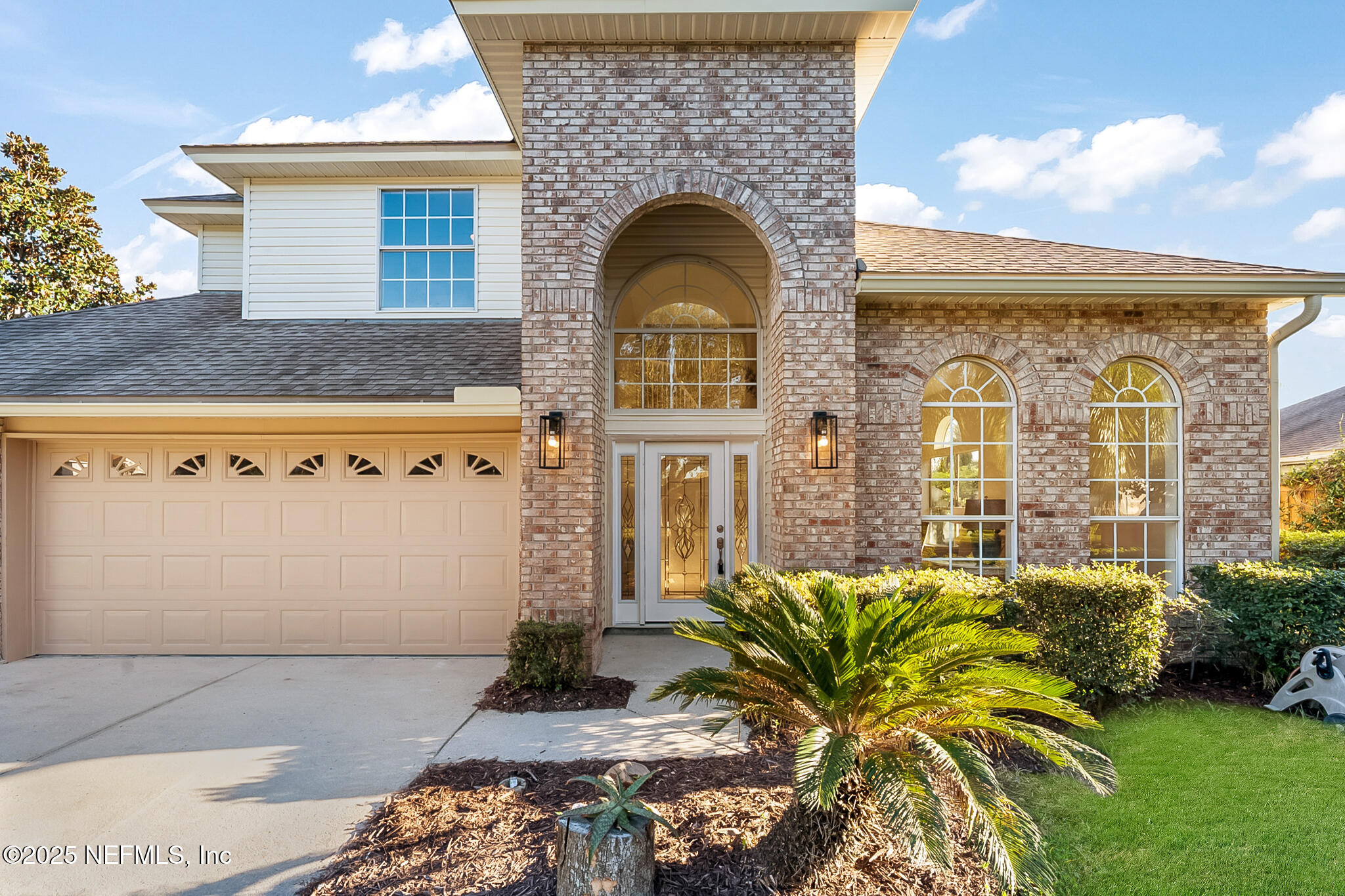 13962 Ibis Point Boulevard Jacksonville, FL 32224 - Photo 7 of 63 a front view of a house with garden