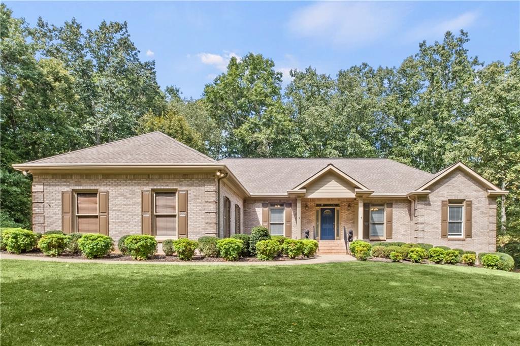 2169 Arbor Hill Road Canton, GA 30115 - Photo 1 of 1 a front view of a house with a yard