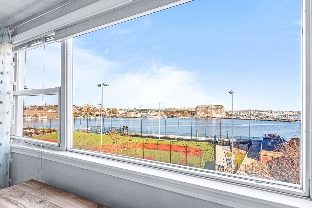 480 Commercial Street, Unit 5B Boston, MA 02109 - Photo 11 of 21 a view of a city from a balcony