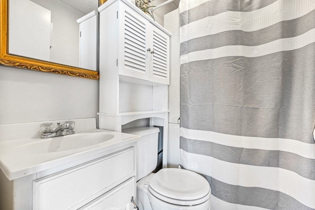 480 Commercial Street, Unit 5B Boston, MA 02109 - Photo 14 of 21 a bathroom with a sink toilet and shower