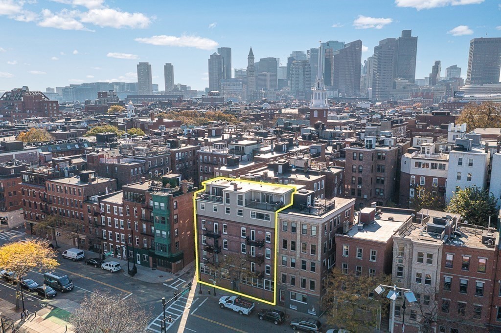 480 Commercial Street, Unit 5B Boston, MA 02109 - Photo 17 of 21 a city view with tall buildings