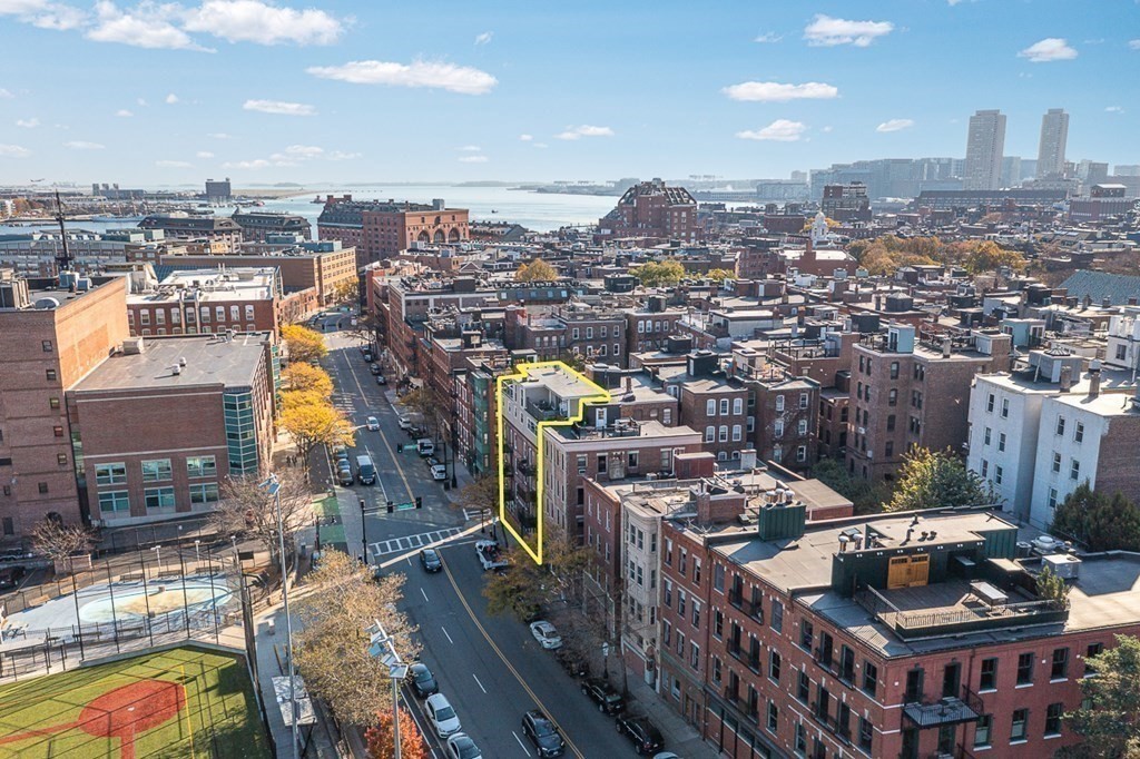 480 Commercial Street, Unit 5B Boston, MA 02109 - Photo 20 of 21 a city view with tall buildings
