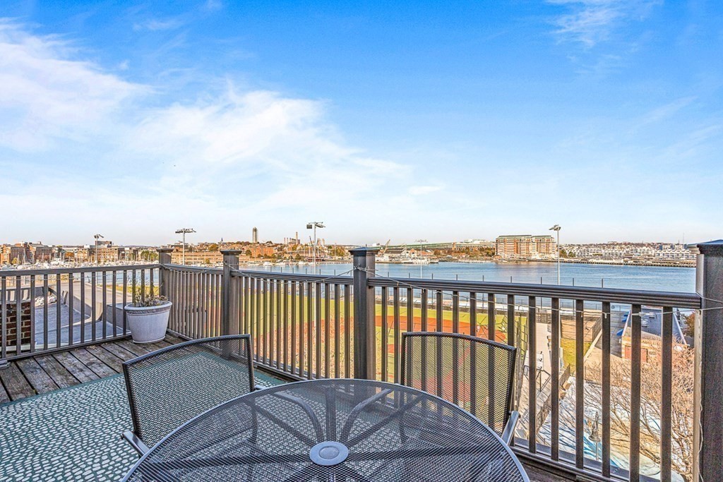 480 Commercial Street, Unit 5B Boston, MA 02109 - Photo 2 of 21 a view of a roof deck with couches