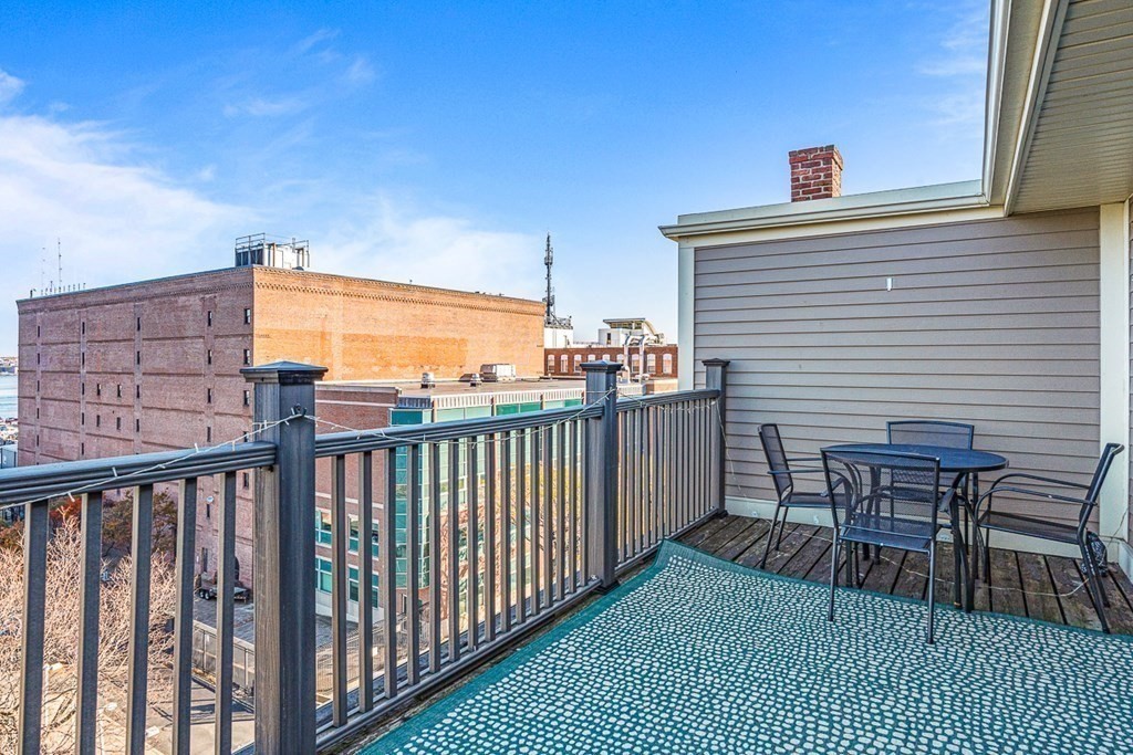 480 Commercial Street, Unit 5B Boston, MA 02109 - Photo 4 of 21 a view of a balcony with furniture