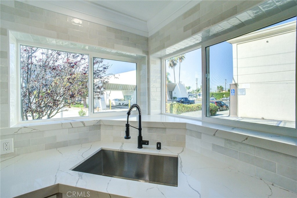 150 Siena Drive Long Beach, CA 90803 - Photo 16 of 40 a kitchen with a sink and a large window