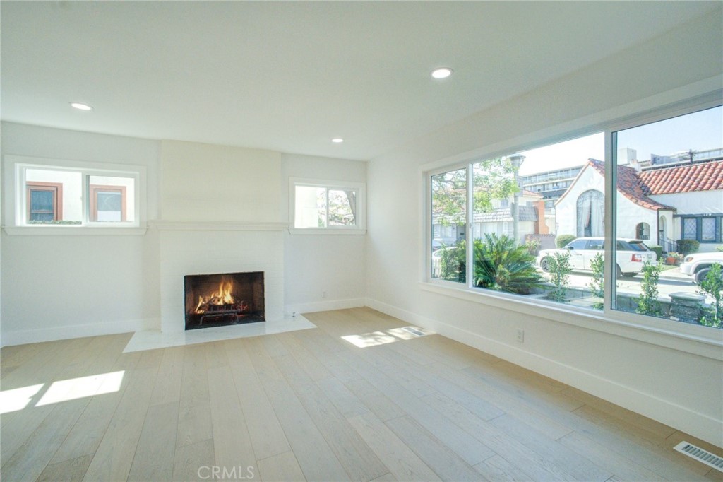 150 Siena Drive Long Beach, CA 90803 - Photo 22 of 40 a view of an empty room with a fireplace and a window