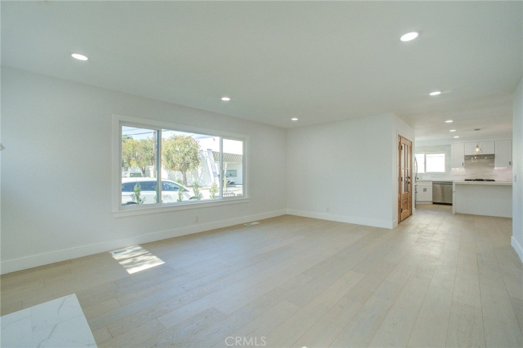 150 Siena Drive Long Beach, CA 90803 - Photo 23 of 40 an empty room with a wooden floor and a window