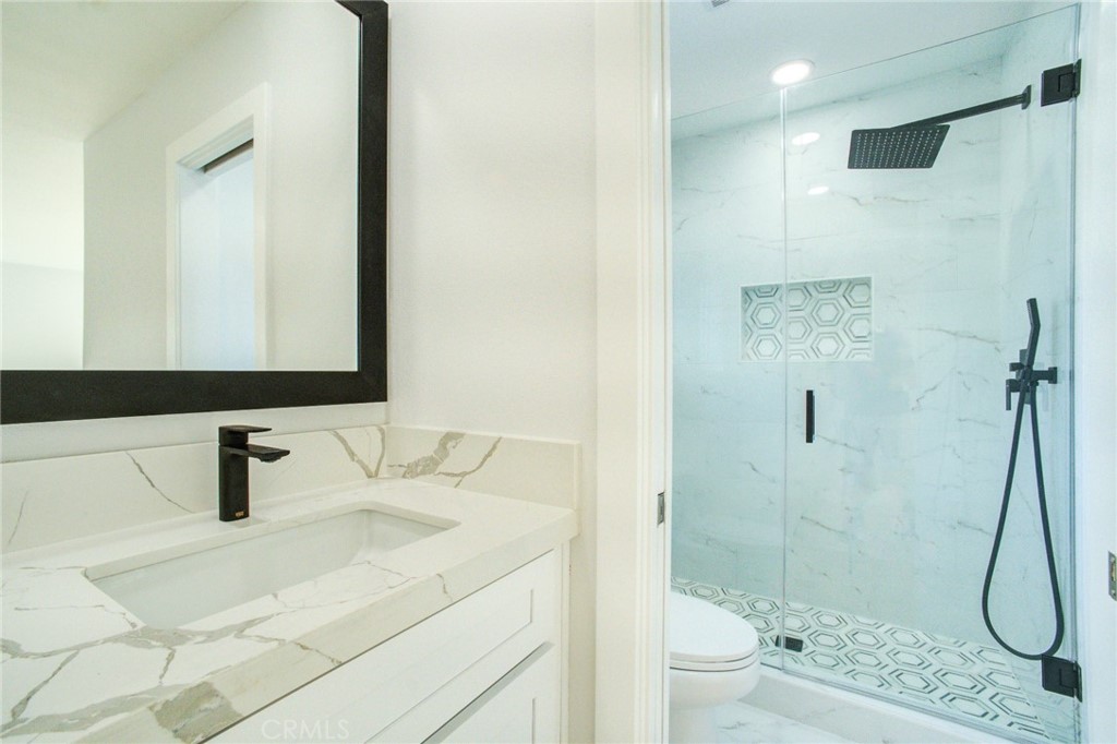 150 Siena Drive Long Beach, CA 90803 - Photo 27 of 40 a bathroom with a sink and a mirror
