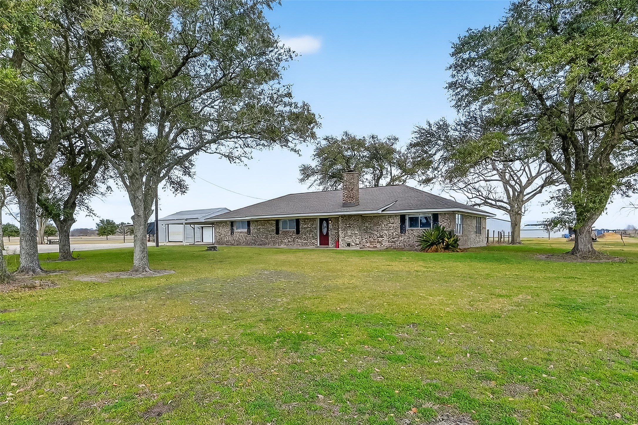 Beautiful brick ranch home nestled on 2.83 unrestricted acres with mature oak trees.