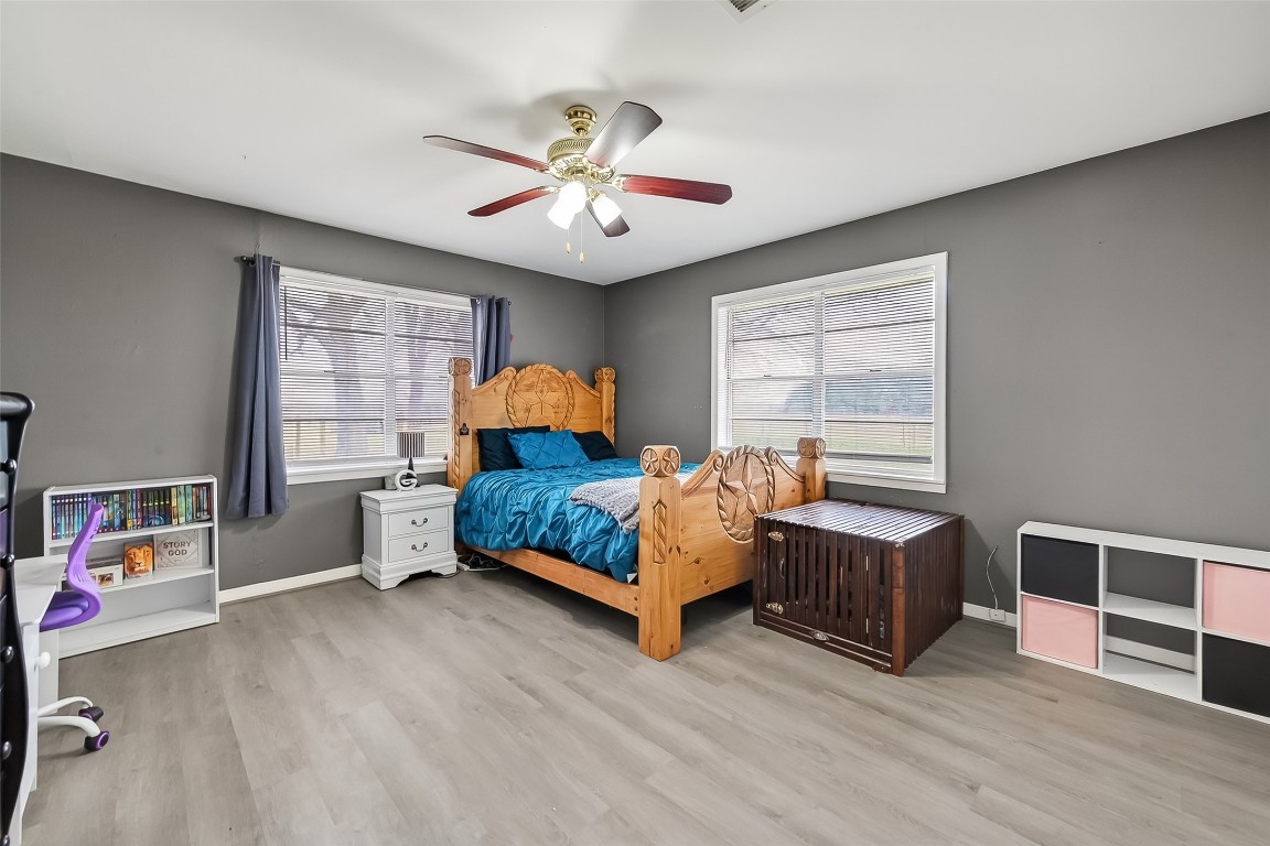 2555 Straznicky Road Beasley, TX 77417 - Photo 13 of 25 Sunny secondary bedroom with peaceful views.