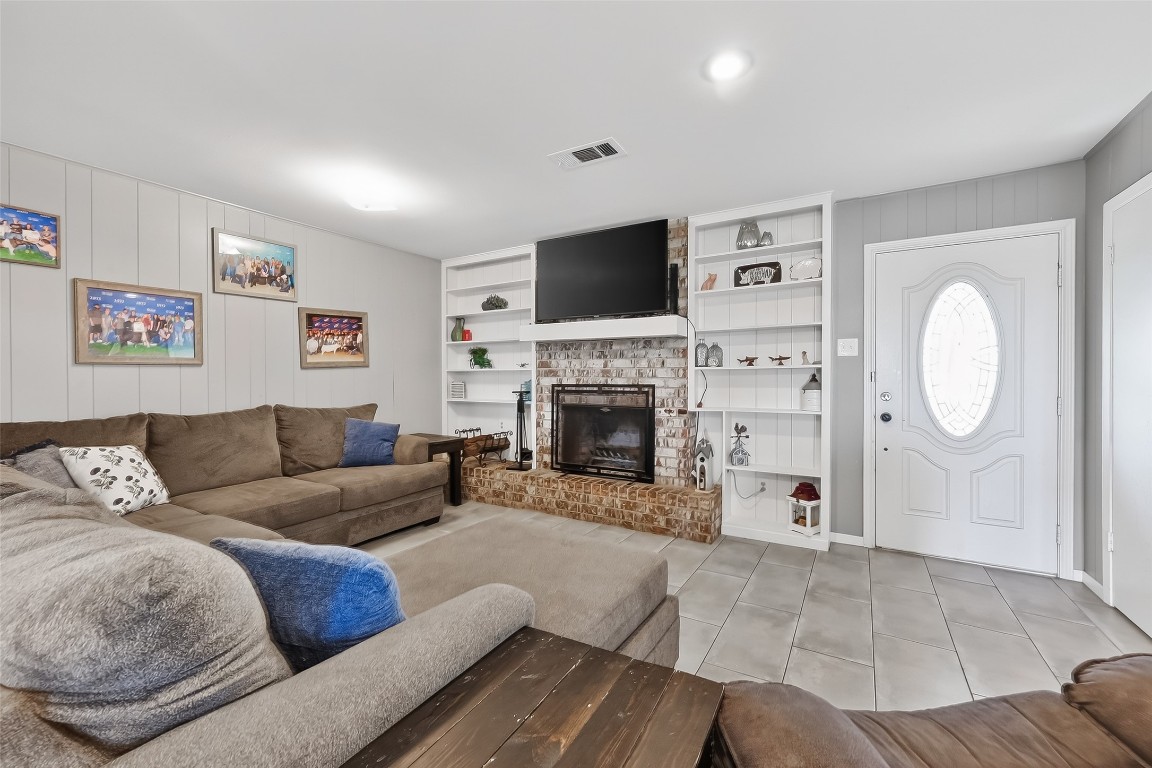 2555 Straznicky Road Beasley, TX 77417 - Photo 5 of 25 Gather around the cozy brick fireplace in this inviting family room.