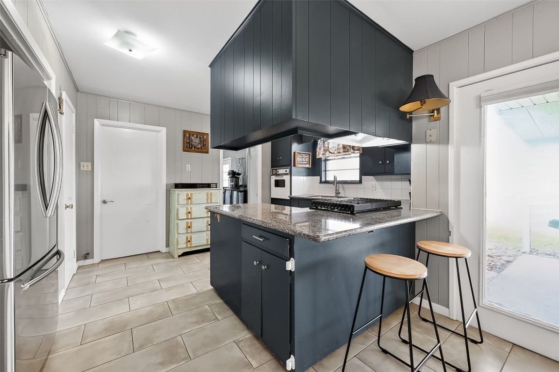 2555 Straznicky Road Beasley, TX 77417 - Photo 8 of 25 Well-designed kitchen with peninsula seating and easy flow to dining and living areas.