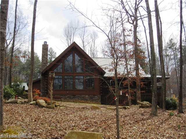 6715 Ventwood Road Climax, NC 27233 - Photo 1 of 16 Exterior Front. Now this is a dream home....custom built log home on 10.67 acres of natural land. Incredible views from every window. Mature trees, winding driveway, natural stream all make this lot beautiful and unique.