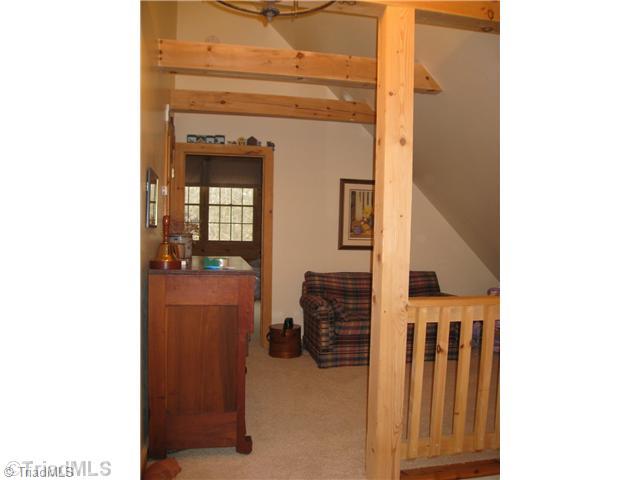 6715 Ventwood Road Climax, NC 27233 - Photo 12 of 16 Loft. This 2nd smaller loft area also has exposed beams and built-in s...perfect for a sitting room or play area. Conveniently located right outside the 3rd bedroom & bath upstairs.