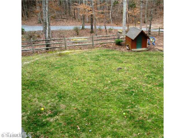 6715 Ventwood Road Climax, NC 27233 - Photo 14 of 16 Yard/Garden. View from the upper balcony/deck looking into the back yard.