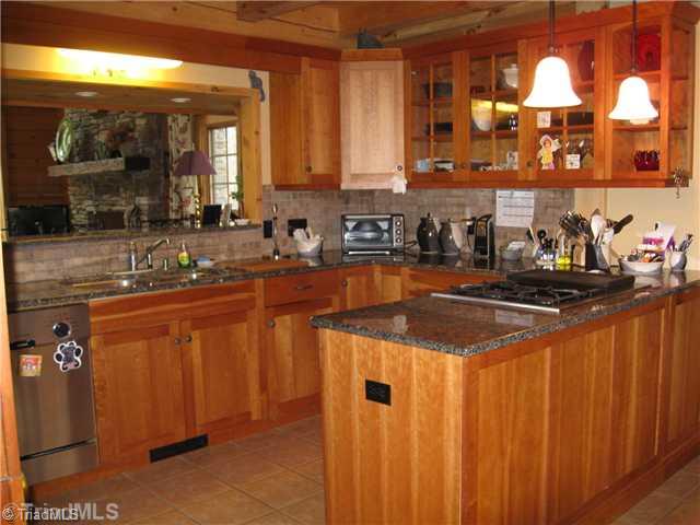 6715 Ventwood Road Climax, NC 27233 - Photo 15 of 16 Kitchen. Gorgeous kitchen overlooks a breakfast bar that is between the kitchen and den. This open floor plan will not disappoint!