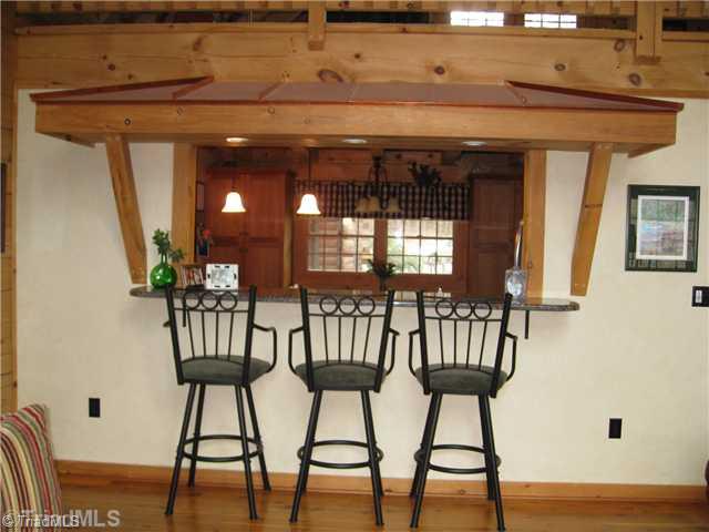 6715 Ventwood Road Climax, NC 27233 - Photo 5 of 16 Kitchen. Breakfast bar is granite and has a decorative pine overhang with copper roof and recessed lighting.