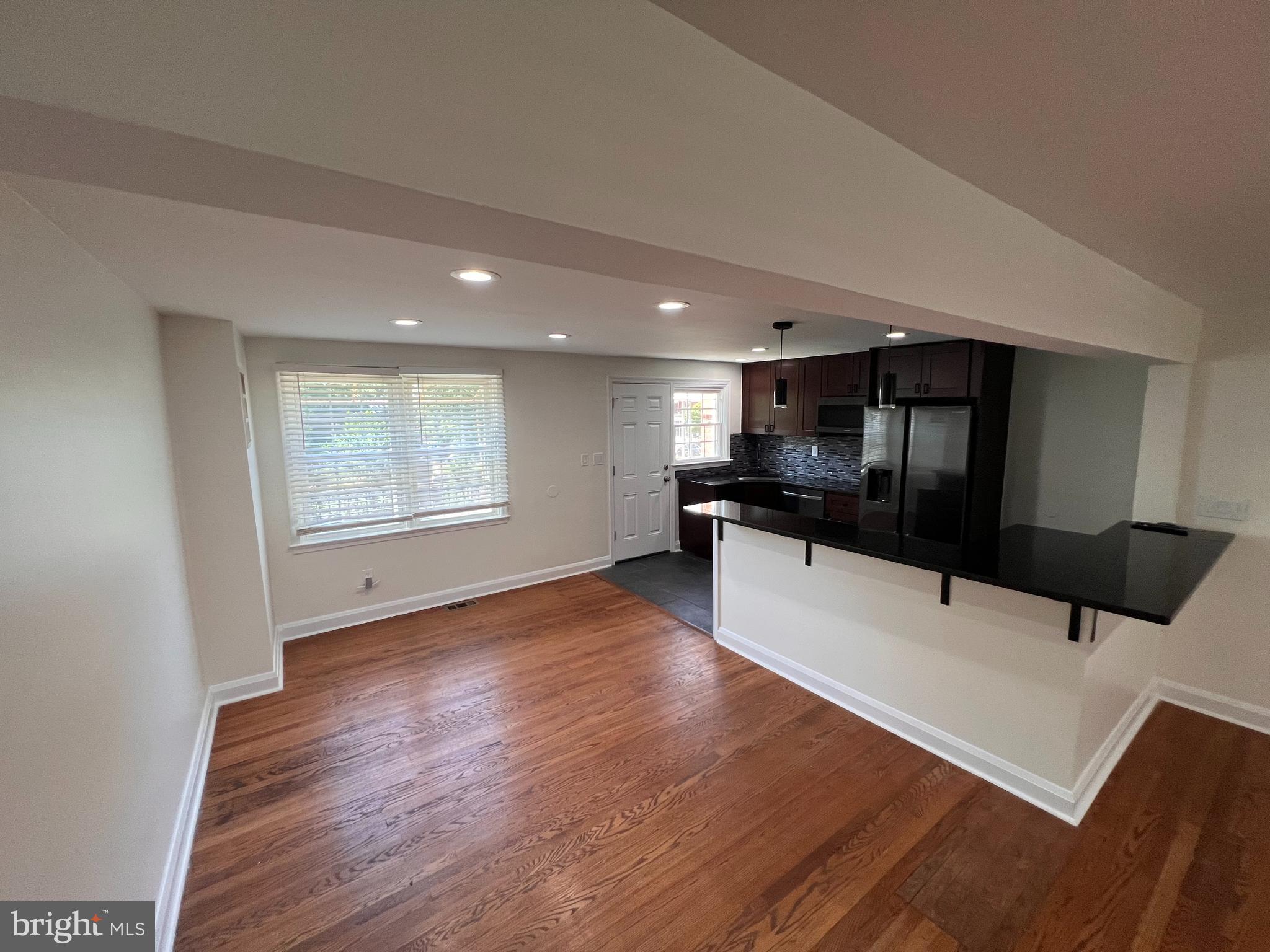 1583 Doxbury Road Towson, MD 21286 - Photo 5 of 31 a kitchen with stainless steel appliances a refrigerator sink and cabinets