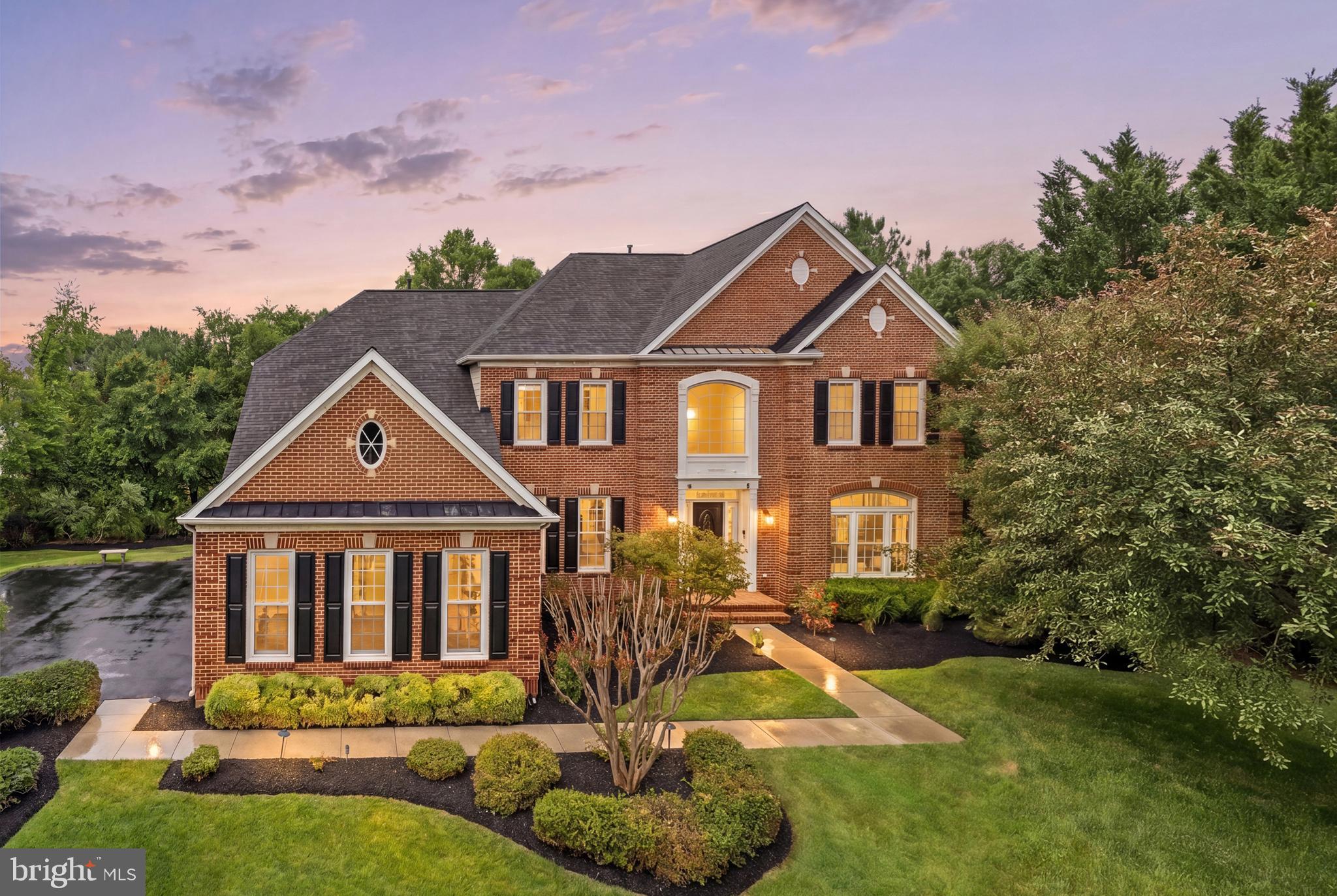 9313 Harrisons Farm Way Laytonsville, MD 20882 - Photo 1 of 77 a front view of a house with a yard